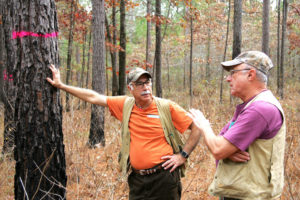 Dr. Salem Salem and Alex Voldog discuss timber management. Sam Duvall, Alabama Forestry Association Communications Director