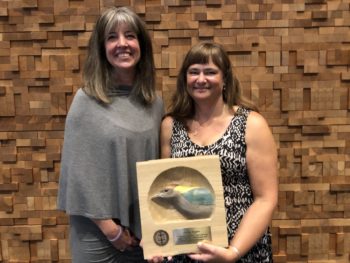 Nicola Koper (right), Professor accepted her 2017 PIF Public Awareness Award at the 27th International Ornithological Congress in Vancouver, BC. Also pictured is Wendy Easton, Canadian Wildlife Service.